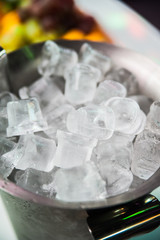 Ice cubes in metallic bucket for shampaghe