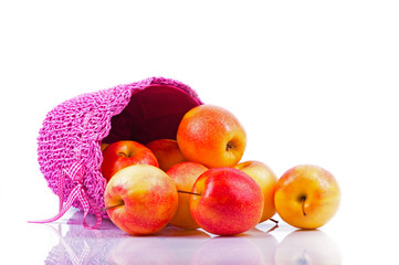 Red apples spilling from basket