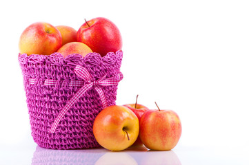 Basket of red apples on white