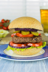 Homemade beef burger and a glass of beer