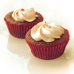 Red velvet cupcake closeup. Filtered to look like an aged instan