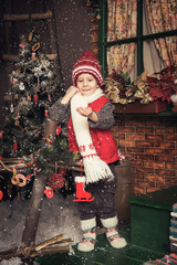 Young boy playing in a Christmas garden - 78921895