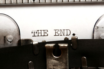 Word THE END written on an old typewriter