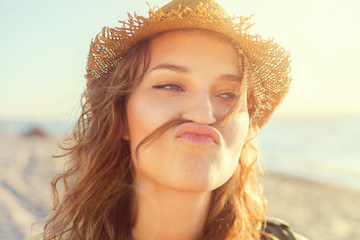 Beautiful girl on a beach is kidding