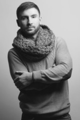 Monohrome portrait of handsome young man in trendy casual sweate