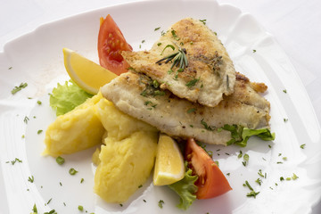 Fried fish with mashed potatoes.
