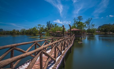 Lake Garden with concrete walkway in a clear nice blue sky