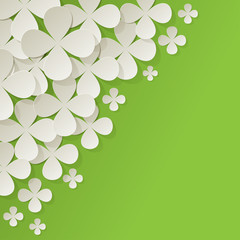 bouquet of white lilac flowers in the corner on green background