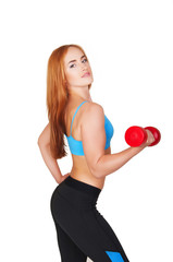 Young fit woman lifting dumbbells on white background