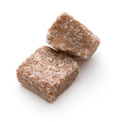 Brown lump cane sugar cube isolated on white background cutout