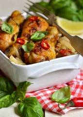 Roasted chicken drumstick in tomato sauce.