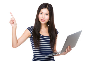 Asian woman hold with laptop and finger point up