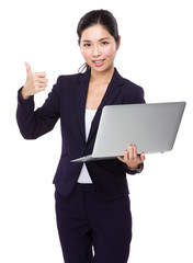 Businesswoman hold with laptop and thumb up