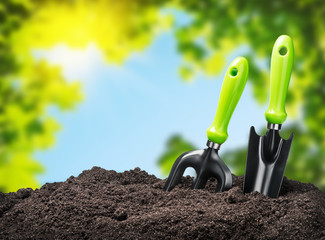 tools garden soil on nature background