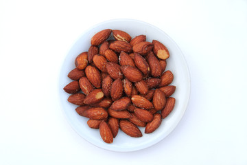 almond with salt in white plate