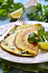 Omelet with cheese and herbs.