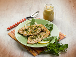 breaded cutlet with herbs and mustard