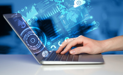 Modern notebook computer with future technology symbols