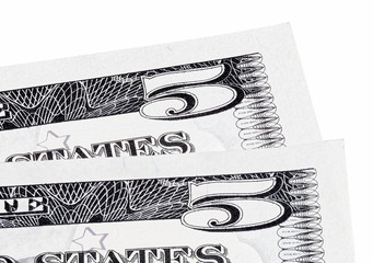 Detail macro photo of two U.S. five dollar banknotes, isolated o