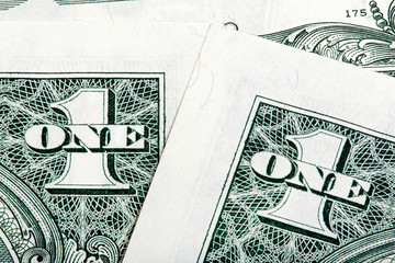 Stack details of one dollar bills close-up shot.