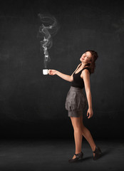 Businesswoman holding a white steamy cup