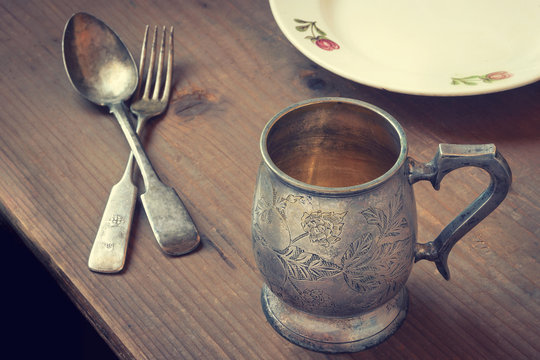 Silver Tableware On A Wooden Table