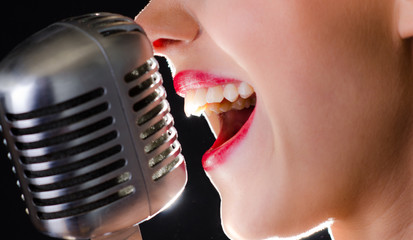 Hot red lips and a silver retro microphone