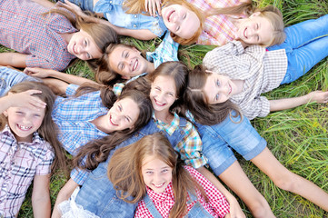Fototapeta premium Portrait of joyful beautiful girlfriends on the nature