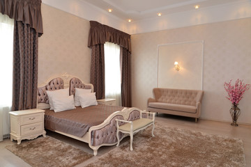 Interior of a bedroom of a double hotel room "luxury" in brown t