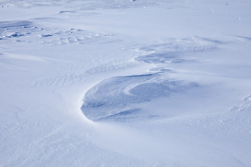 Fototapeta na wymiar smooth snow cover in the winter sunlit