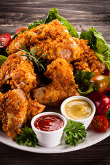 Fried chicken nuggets and vegetables