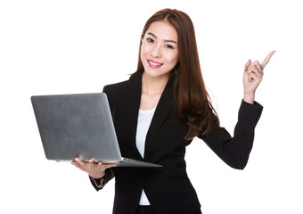 Business woman hold laptop and finger point up