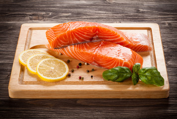 Fresh raw salmon fillet on cutting board