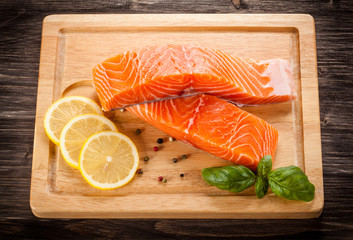 Fresh raw salmon fillet on cutting board