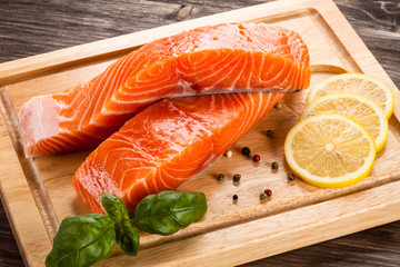 Fresh raw salmon fillet on cutting board