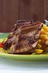 Grilled ribs on plate