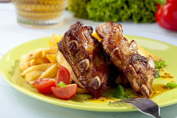Grilled ribs on plate