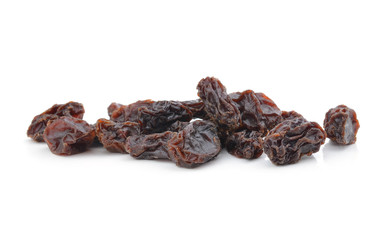 Dried raisins on a white background