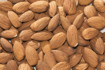 Fototapeta premium Shelled almonds closeup, background