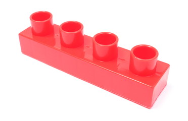 Red building block on white background