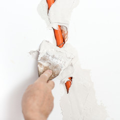 Plastering Flexible Corrugated Cable Duct into the wall