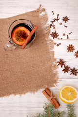 Mulled wine, punch and spices for glintwine on wooden background