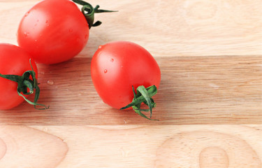 fresh cherry tomato wooden background