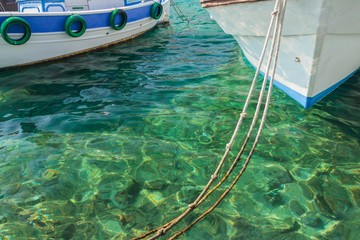 Boats in clear sea near Greek island Kalymnos