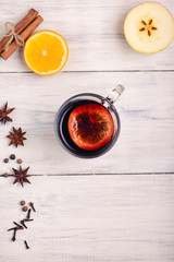 Mulled wine, punch and spices for glintwine on wooden background