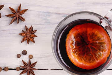 Mulled wine, punch and spices for glintwine on wooden background