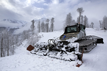 Plow snow removal equipment in the mountains of Roza Khutor