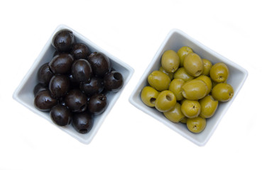 Bowls with green and black olives from above