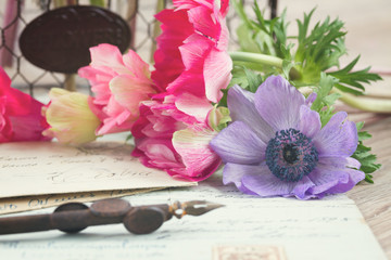 quill pen and antique letters with flowers