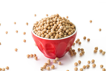 Small chickpeas in a red bowl on a white background